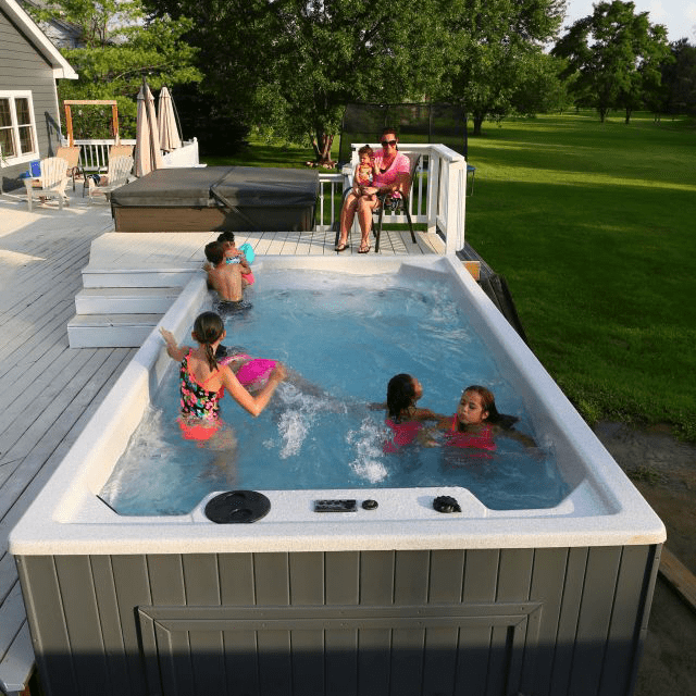 Royal Spa Swim Spa with multiple kids playing